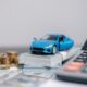 Incentivi, calcolatrice, soldi, modellino auto