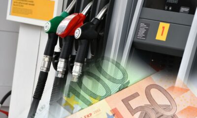 Pompe di benzina in una stazione di servizio con banconote in euro. Aumento dei prezzi.